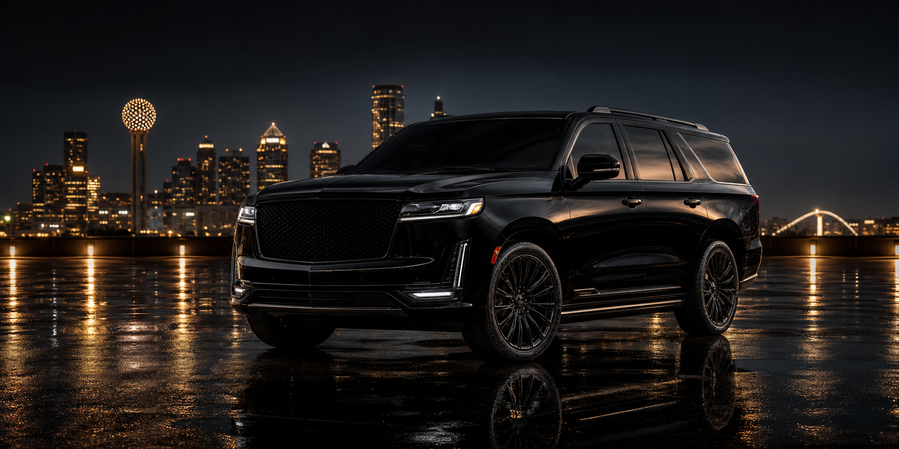 Black luxury SUV staged at night against the Dallas skyline