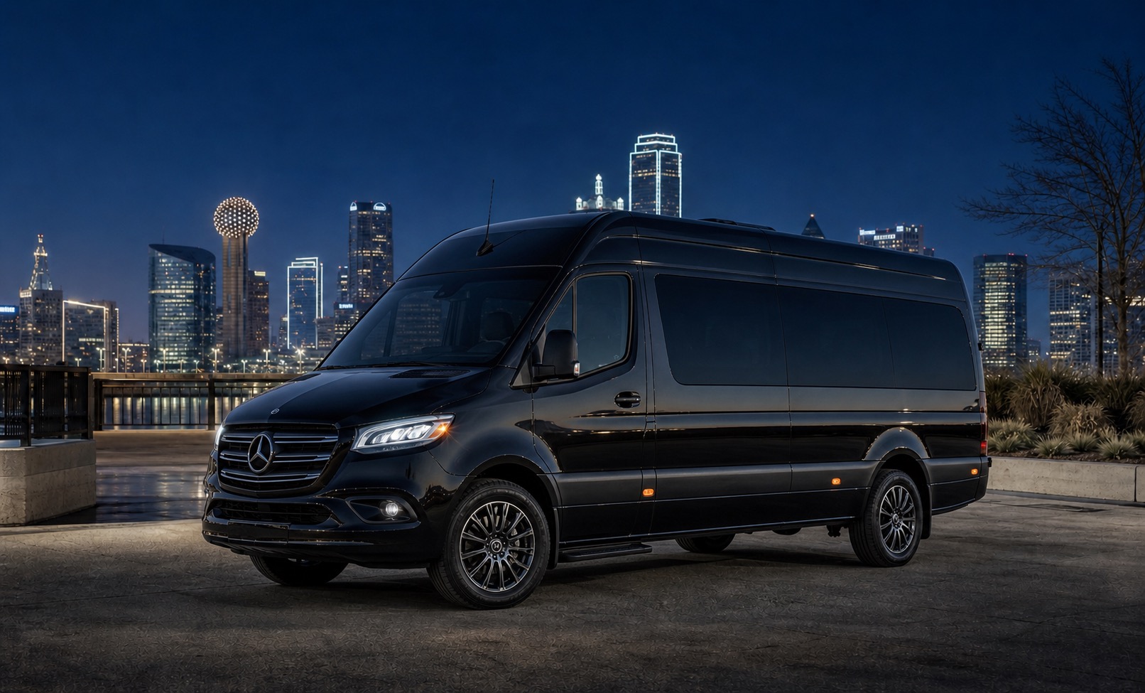 Black Mercedes-Benz Sprinter van facing left against the Dallas skyline